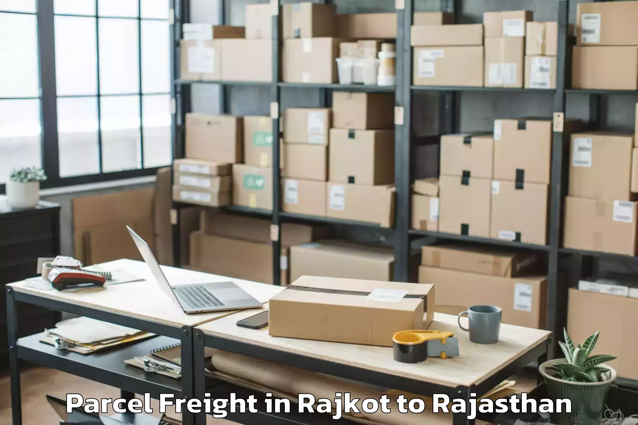 Book Rajkot to Jk Lakshmipat University Jaipu Parcel Freight Online